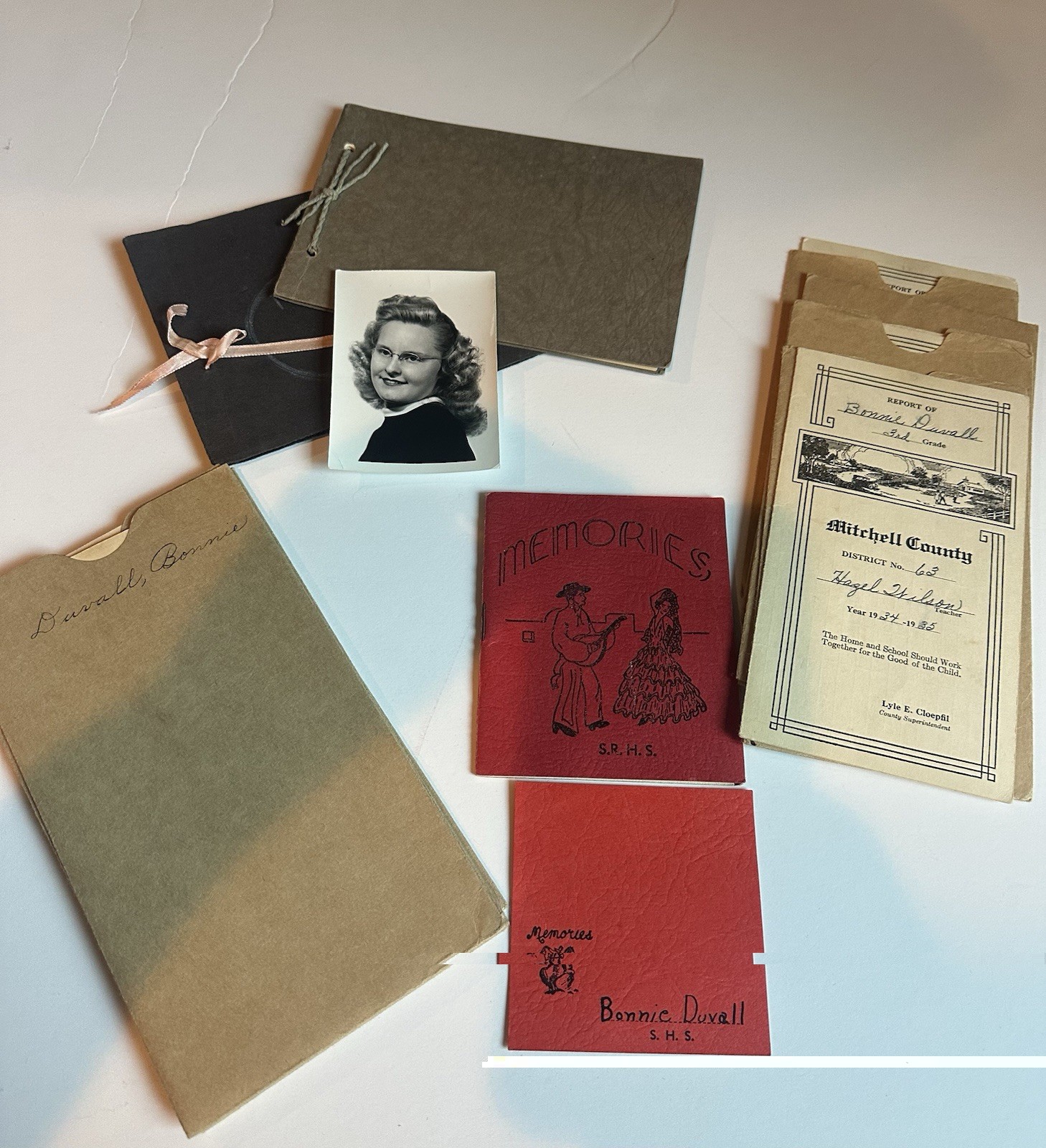 Vintage school memorabilia lot—report cards, memory booklets and ...